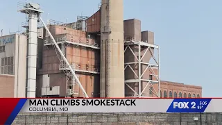 Man climbs power plant smokestack in Columbia