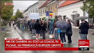 Thousands of people waited in line in the rain to get free burgers
