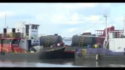 Rising river levels keep Puerto Botánico residents on alert