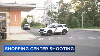 Man dies after being found shot near shopping center