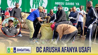MKUU WA WILAYA JIJINI ARUSHA AONGOZA WANANCHI KUZIBUA MITARO KUJIHADHARI NA EL NINO