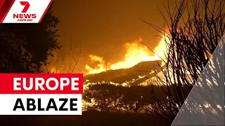 Mass evacuations as European wildfires rage | 7NEWS